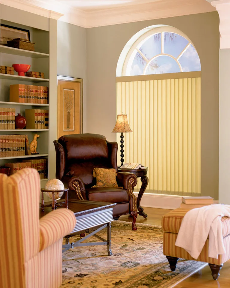Vertical blinds on a wall of windows